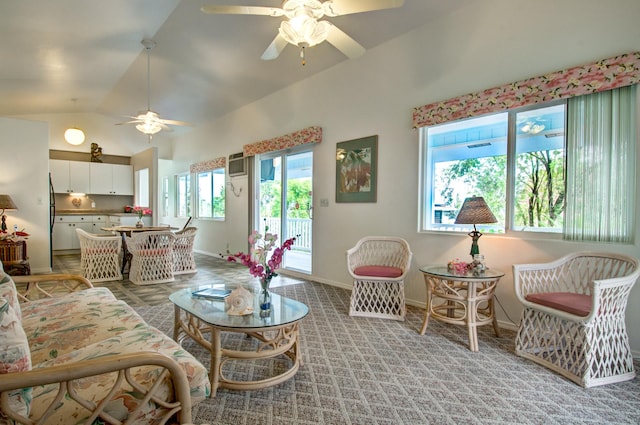 living room featuring ceiling fan, light colored carpet, and lofted ceiling