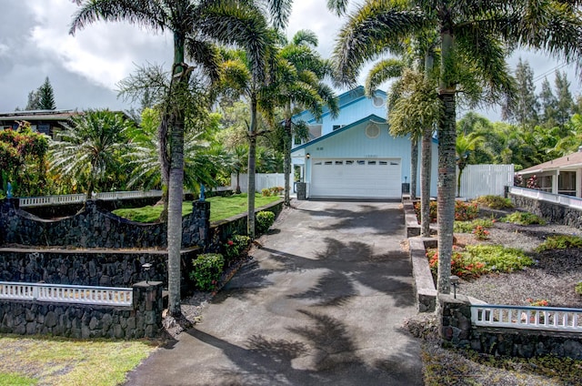 view of front of property with a garage