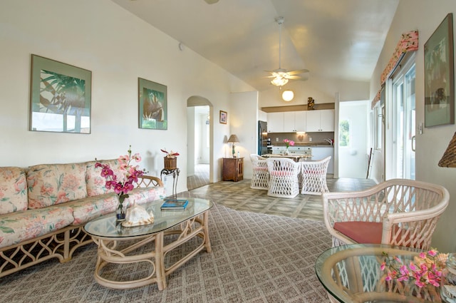 living room featuring lofted ceiling and ceiling fan