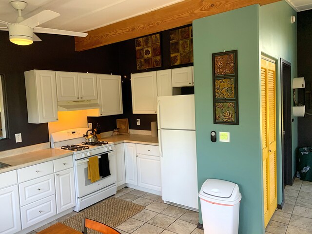 kitchen with white cabinetry, white appliances, ceiling fan, and light tile patterned flooring