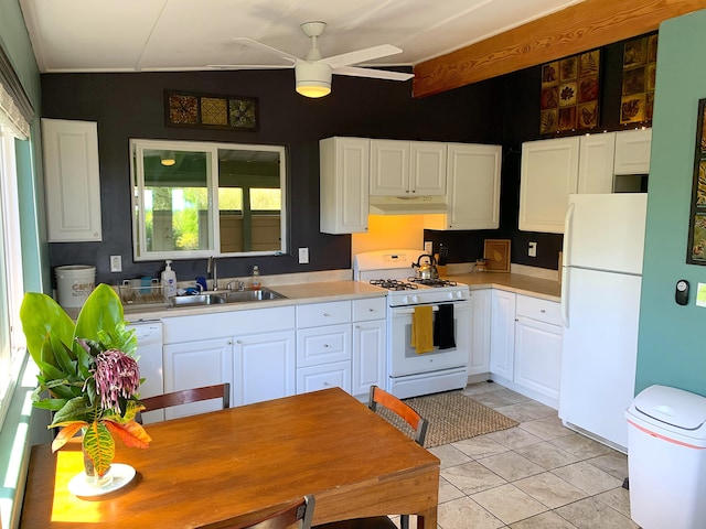 kitchen featuring sink, white appliances, light tile patterned floors, ceiling fan, and white cabinets