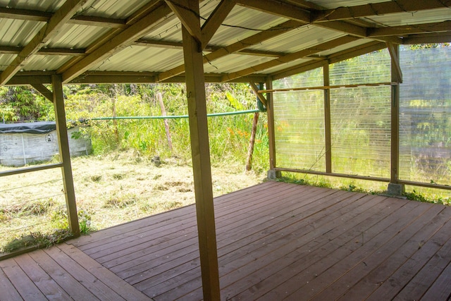 unfurnished sunroom with vaulted ceiling