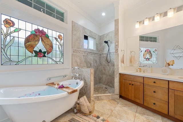 bathroom with tile patterned floors, vanity, crown molding, and independent shower and bath