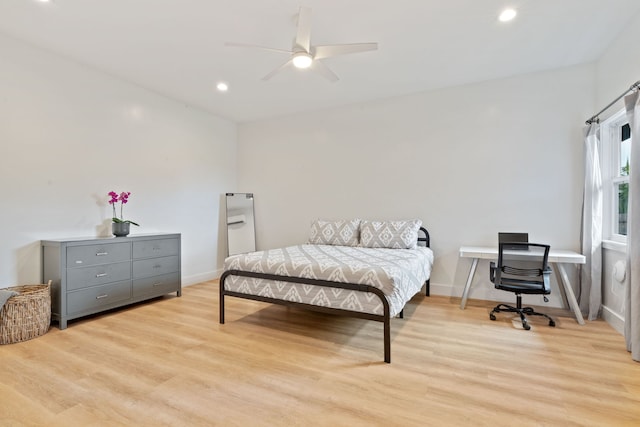 bedroom featuring ceiling fan and light hardwood / wood-style flooring