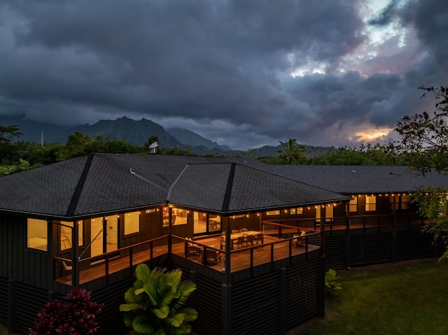 rear view of house with a mountain view