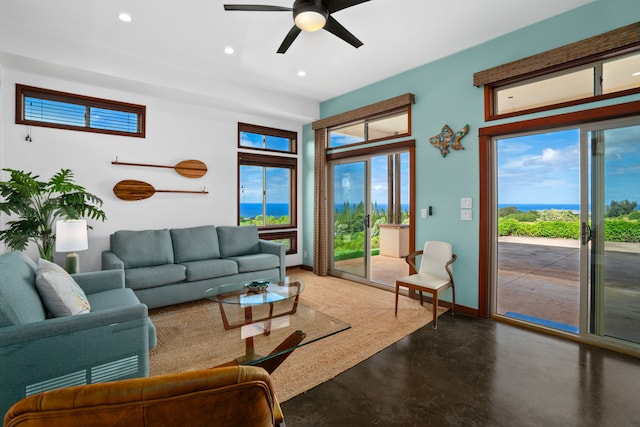 living room featuring concrete flooring and ceiling fan