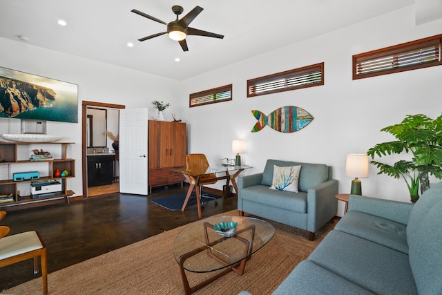 living room with dark wood-type flooring and ceiling fan