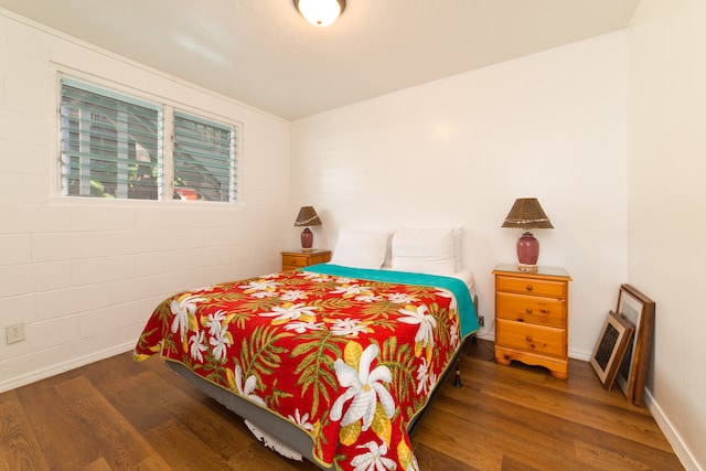 bedroom featuring dark hardwood / wood-style flooring