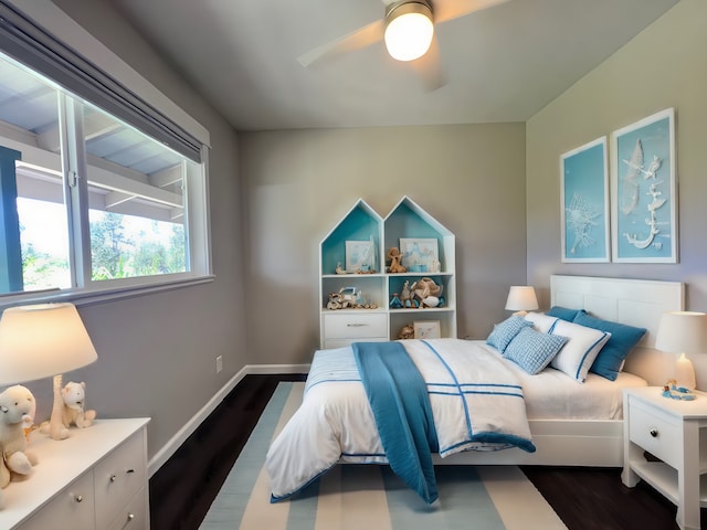 bedroom with ceiling fan and dark hardwood / wood-style floors