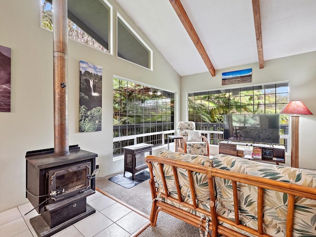 interior space with lofted ceiling with beams and a wood stove