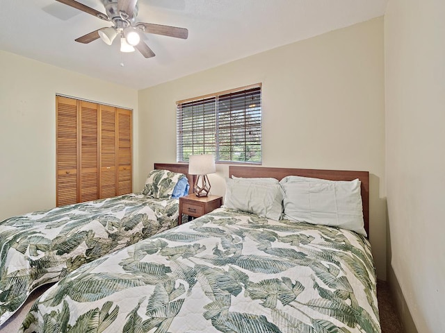 bedroom with ceiling fan and a closet