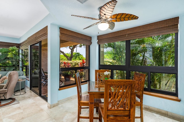 dining room with ceiling fan, light tile patterned flooring, and a healthy amount of sunlight