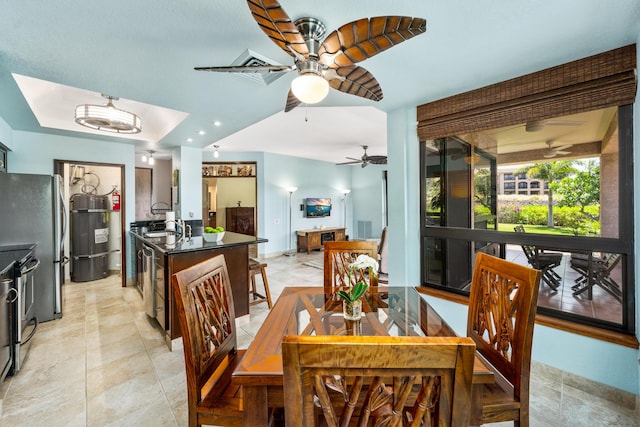 tiled dining room featuring ceiling fan