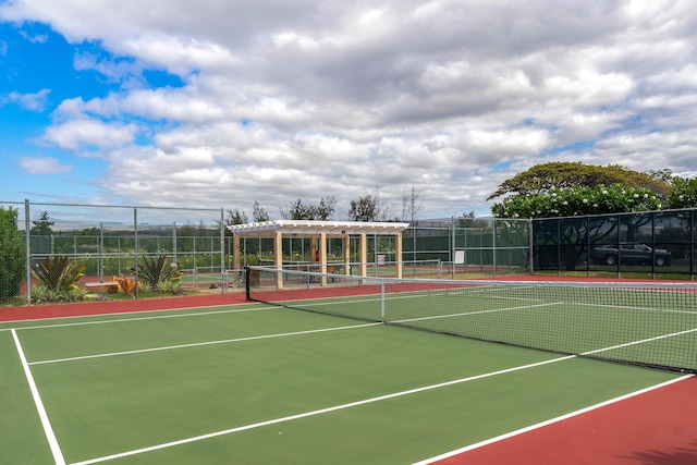 view of tennis court with a pergola