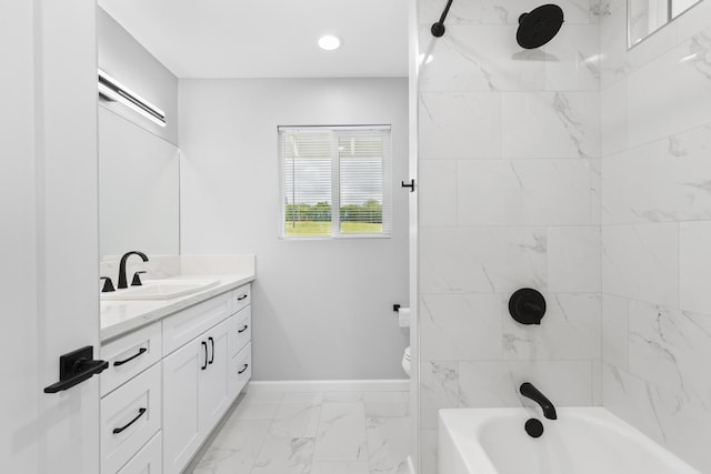 full bathroom with vanity, tiled shower / bath combo, and toilet