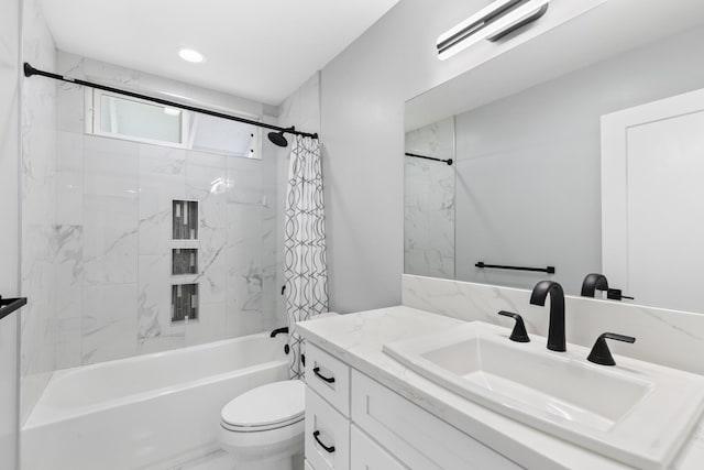 full bathroom with vanity, toilet, and shower / bath combo with shower curtain