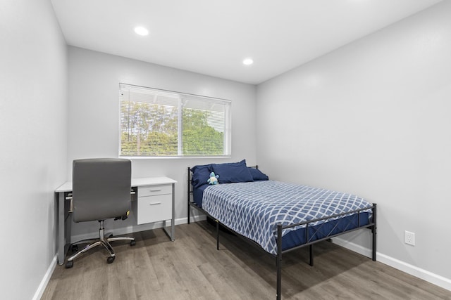 bedroom with light wood-type flooring