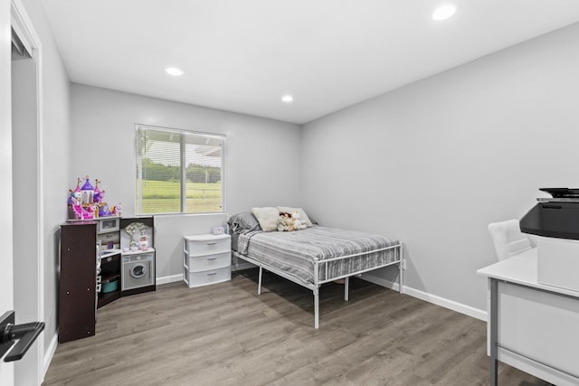 bedroom featuring wood-type flooring