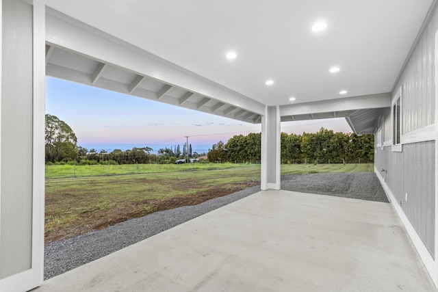 patio terrace at dusk with a yard