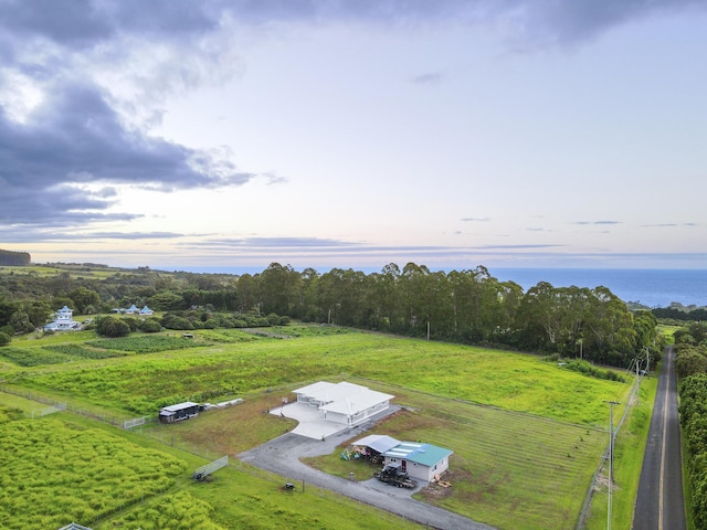 aerial view at dusk featuring a rural view