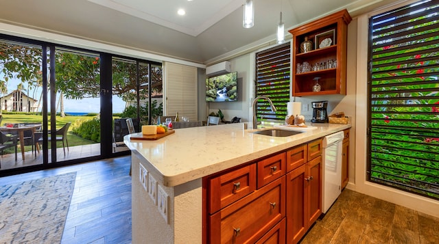 kitchen featuring light stone countertops, dark hardwood / wood-style flooring, white dishwasher, sink, and hanging light fixtures