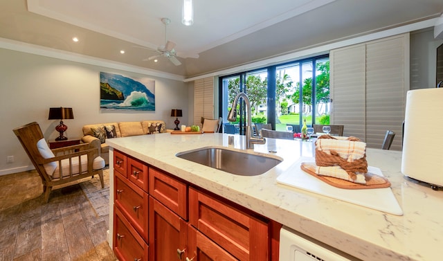 kitchen featuring sink, ceiling fan, dark hardwood / wood-style floors, light stone countertops, and ornamental molding