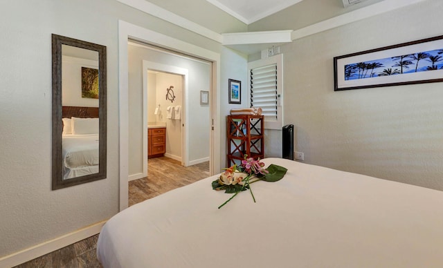 bedroom featuring hardwood / wood-style flooring and ornamental molding