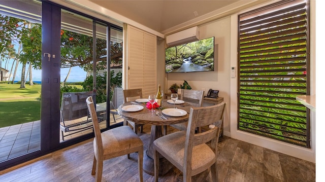 sunroom with a wall mounted air conditioner