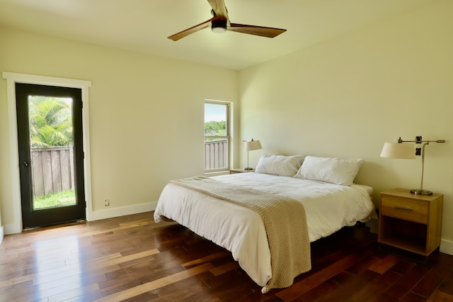 bedroom featuring ceiling fan, dark hardwood / wood-style flooring, and access to exterior