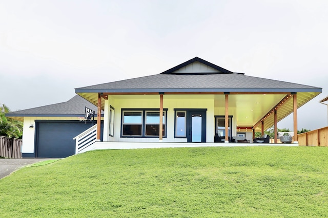 exterior space featuring a lawn and a garage