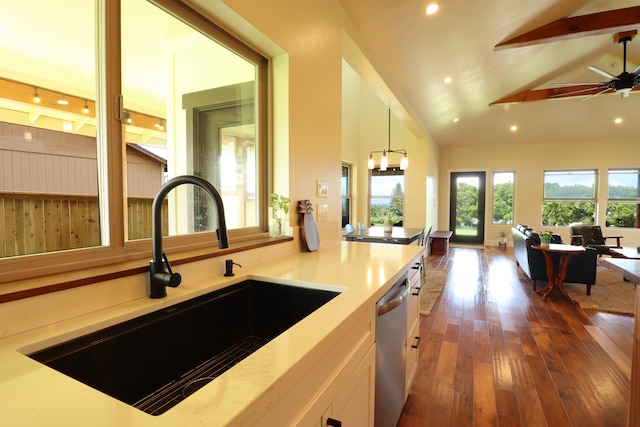 kitchen featuring stainless steel dishwasher, sink, white cabinets, dark hardwood / wood-style flooring, and ceiling fan