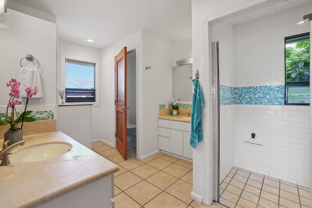 bathroom with tile patterned floors and vanity