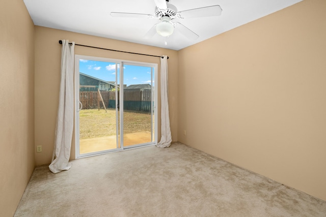 carpeted empty room with ceiling fan