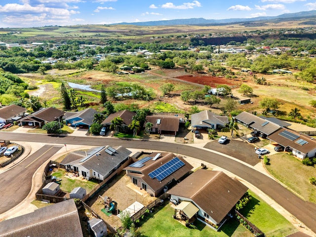 birds eye view of property featuring a mountain view