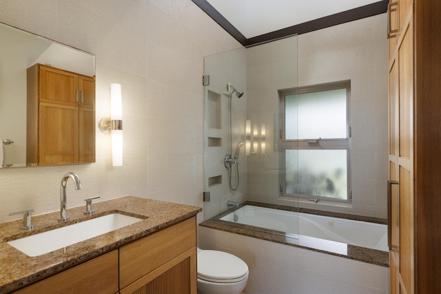 full bathroom with vanity, combined bath / shower with glass door, and toilet