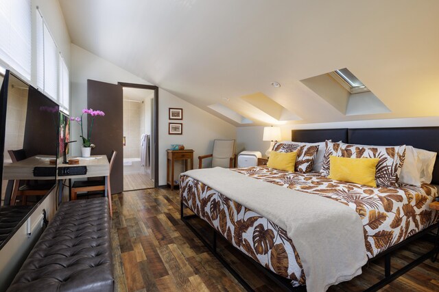 bedroom featuring lofted ceiling with skylight and dark hardwood / wood-style floors