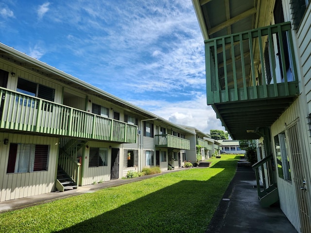 view of yard featuring a balcony