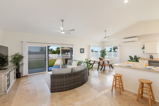 tiled living room with vaulted ceiling, ceiling fan, and plenty of natural light