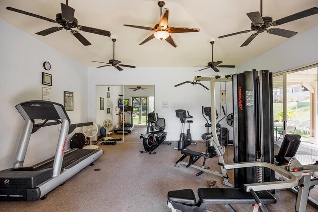 interior space featuring ceiling fan and lofted ceiling