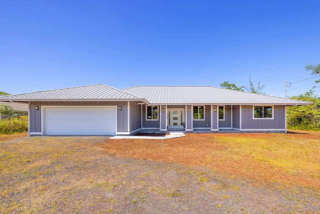 view of front of house with a garage and a porch