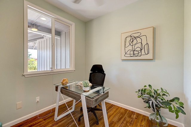 office space with ceiling fan and wood-type flooring