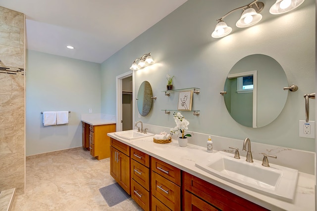 bathroom featuring tile patterned floors and dual bowl vanity