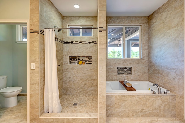 bathroom featuring shower with separate bathtub, tile patterned floors, and toilet