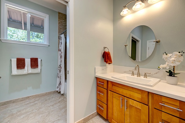 bathroom featuring shower / bath combo, vanity, and tile patterned flooring