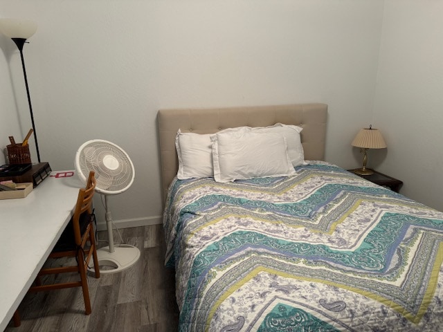 bedroom with wood-type flooring