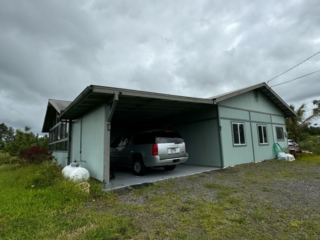 view of home's exterior with a carport