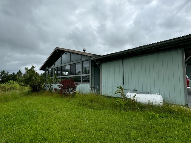 view of property exterior featuring a yard