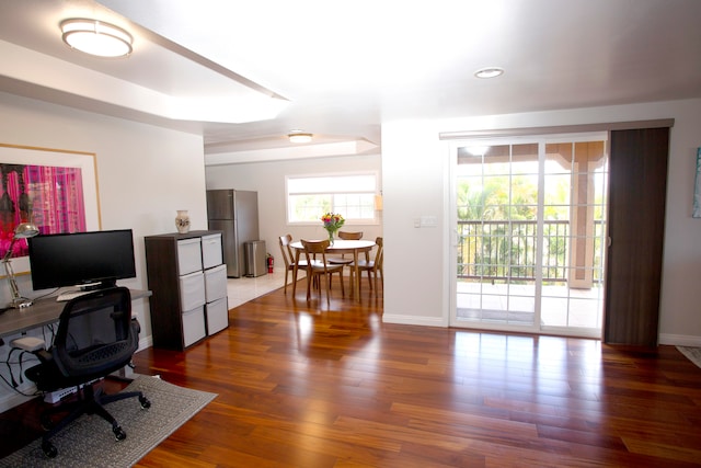 home office with wood-type flooring