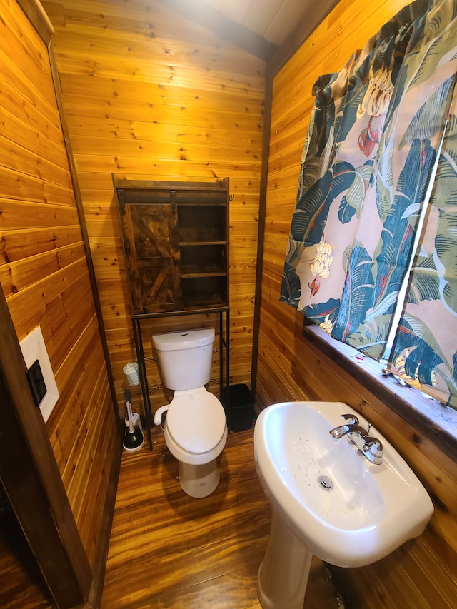 bathroom with sink, wooden walls, wooden ceiling, and vaulted ceiling