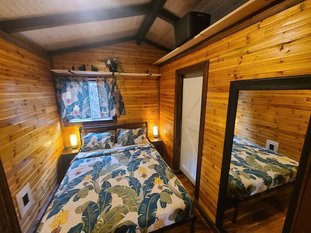 bedroom featuring lofted ceiling with beams, wooden walls, hardwood / wood-style flooring, and wood ceiling